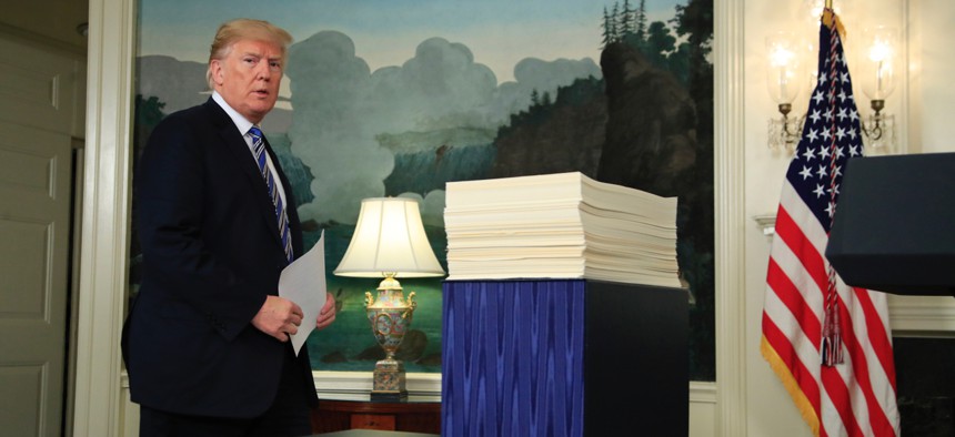President Donald Trump arrives in the Diplomatic Room of the White House in Washington on March 23 to speak about the $1.3 trillion spending bill which he signed earlier in the day.