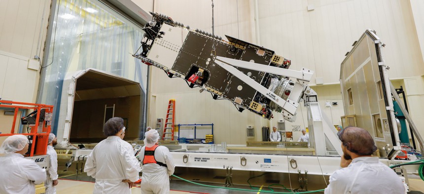 Lockheed plans to show the Saudi crown prince the Arabsat-6A satellite, here being prepared in a clean room near Denver before being moved to the company's Sunnyvale, California, facility for final testing.
