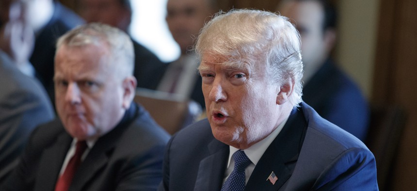 Acting Secretary of State John Sullivan listens as President Donald Trump speaks during a cabinet meeting at the White House, April 9, 2018, in Washington.