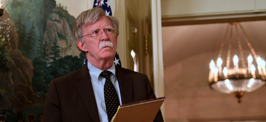 National Security Adviser John Bolton attends a meeting with President Trump in the White House, in April.