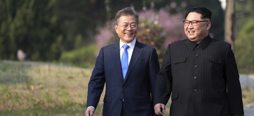 North Korean leader Kim Jong Un, right, and South Korean President Moon Jae-in walk together at the border village of Panmunjom in the Demilitarized Zone, South Korea, Friday, April 27, 2018. 