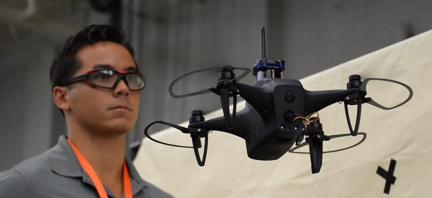 Brandon Tseng commands an autonomous drone during the ThunderDrone Tech Expo at SOFWERX in Tampa, Fla., in September. 