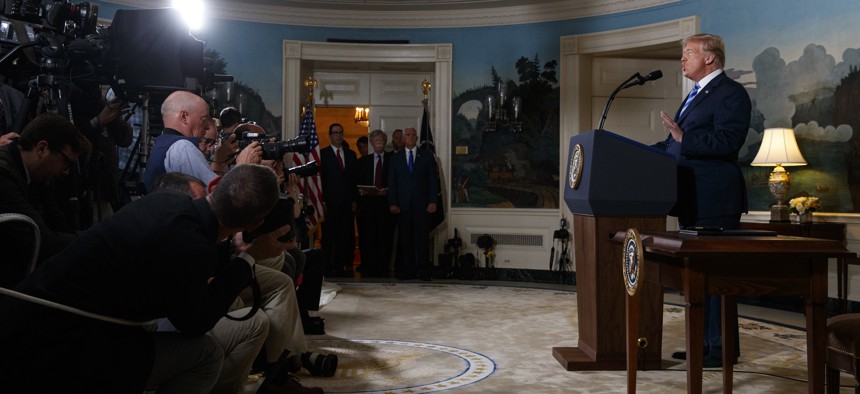 President Donald Trump delivers a statement on the Iran nuclear deal from the Diplomatic Reception Room of the White House, Tuesday, May 8, 2018