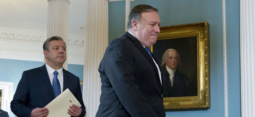 US Secretary of State Mike Pompeo accompanied by Georgian Prime Minister Giorgi Kvirikashvili arrive for a news conference before their bilateral meeting at the State Department, Monday, May 21, 2018, in Washington. 