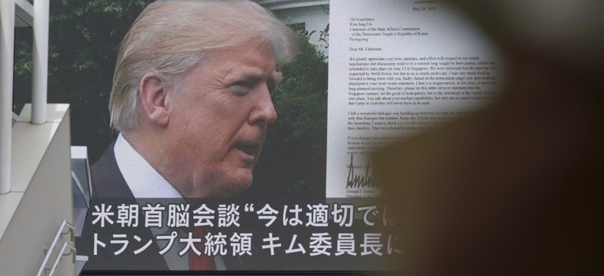 A TV screen showing U.S. President Donald Trump, right, in Tokyo, May 25, 2018.