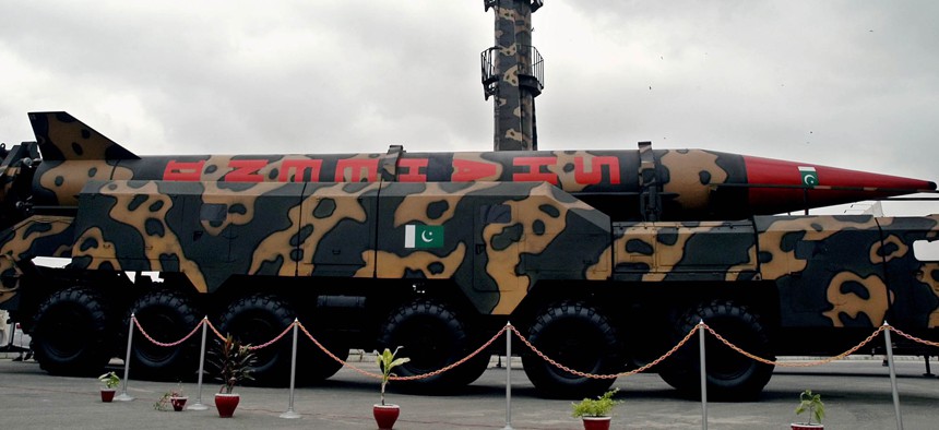 A Pakistan-made Shaheen missile capable of carrying nuclear heads, front, is displayed at a defense exhibition on, September 14, 2004 in Karachi, Pakistan. 