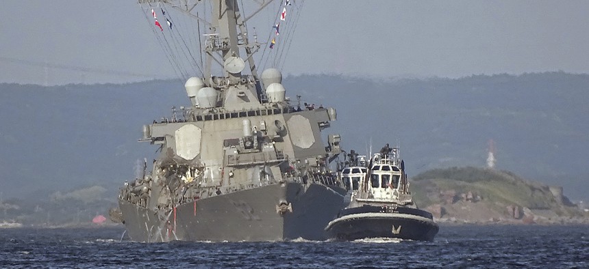 June 17, 2017: the damaged USS Fitzgerald is towed by a tugboat in the waters near the U.S. Naval base in Yokosuka, southwest of Tokyo, after the U.S. destroyer collided with the Philippine-registered container ship ACX Crystal.