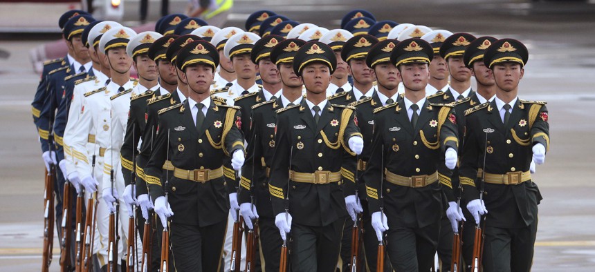 Chinese People's Liberation Army honor guard march after Russian President Vladimir Putin arrived at Xiamen Gaoqi International Airport to attend the upcoming BRICS Summit in Xiamen, China's Fujian province, Sunday, Sept. 3, 2017.