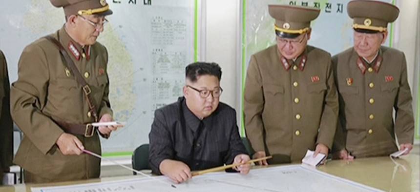 In this file image made from video of an Aug. 14, 2017, broadcast in a news bulletin by North Korea's KRT, North Korean leader Kim Jong Un receives a military briefing in Pyongyang.