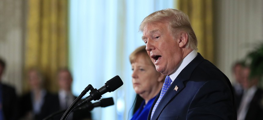 President Donald Trump and German Chancellor Angela Merkel speak during a news conference in the East Room of the White House in Washington, Friday, April 27, 2018.