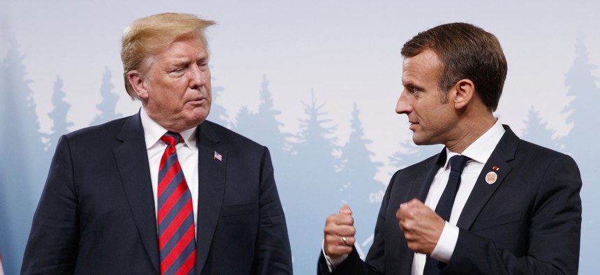 President Donald Trump meets with French President Emmanuel Macron during the G-7 summit Friday, June 8, 2018, in Charlevoix, Canada.