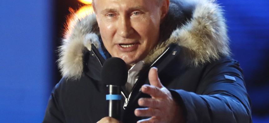 Russian President Vladimir Putin gestures as he speaks to supporters during a rally near the Kremlin in Moscow, Sunday, March 18, 2018. 