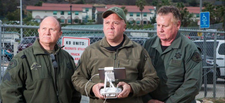 Sergeant Eric Fox, Sergeant John Hanson, and Deputy Joe Wooley of the Los Angeles County Sheriff's Department operate the county's single U.A.S., or drone.