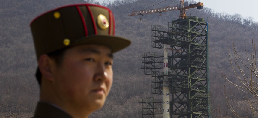 A North Korean soldier stands in front of the country's Unha-3 rocket, slated for liftoff between April 12-16, at a launching site in Tongchang-ri, North Korea on Sunday April 8, 2012. North Korean space officials have moved a long-range rocket.