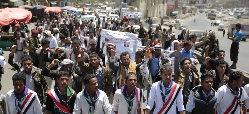 People take part in a march, denouncing plans by the Arab coalition to attack Hodeidah, from Sanaa to the port city of Hodeidah, Yemen, Wednesday, Apr. 19, 2017.