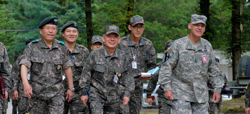 South Korean Adm. Choi Yoonhee, center, ROK's top officer; U.S. Lt. Gen. Stephen Lanza, right, who leads I Corps; and South Korean Gen. Hyunjip Kim, left, 3rd ROK commander, at Camp Yongin, South Korea, during Ulchi Freedom Guardian 2014.