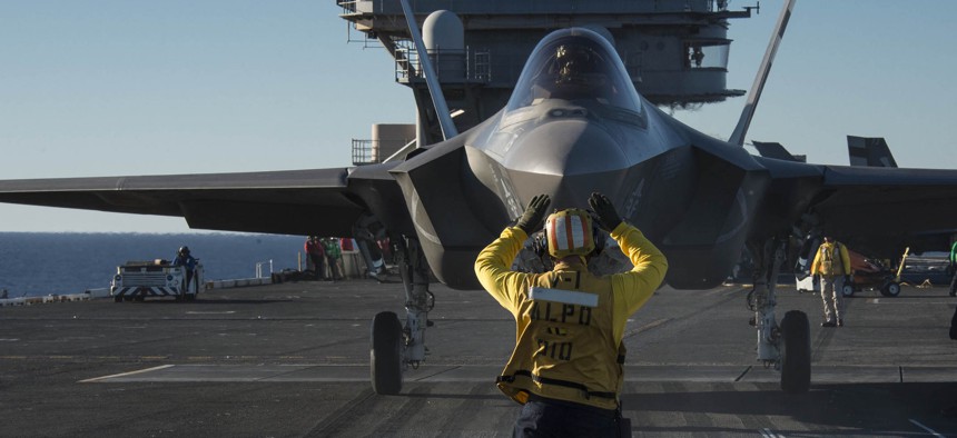 An F-35C Lightning II carrier variant joint strike fighter is prepared for launch aboard the aircraft carrier USS Nimitz (CVN 68).