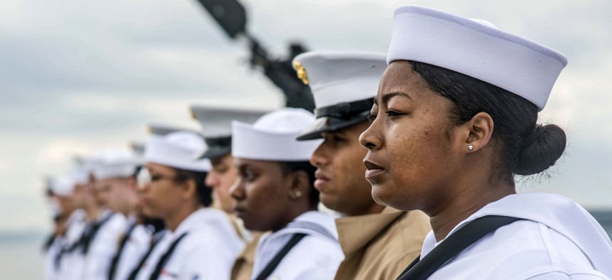 Sailors and Marines man the rails aboard the USS Arlington (LPD-24) in New York City for Fleet Week, May 22, 2018. 