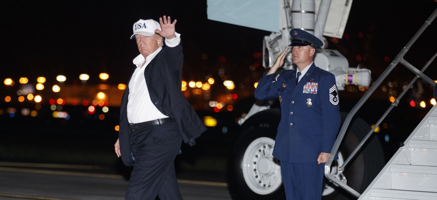 President Donald Trump waves as he arrives on Air Force One at Newark Liberty International Airport, in Newark, N.J., Thursday, July 5, 2018, en route to Bedminster, N.J., after participating in a rally in Great Falls, Mont.