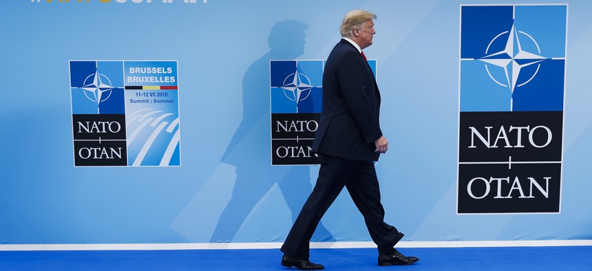 President Donald Trump enters the NATO Summit of heads-of-state and -government at headquarters in Brussels on Wed., July 11, 2018.