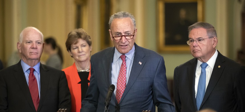 Senate Minority Leader Chuck Schumer, D-N.Y., joined from left by, Sen. Ben Cardin, D-Md., Sen. Jeanne Shaheen, D-N.H., and Sen. Bob Menendez, D-N.J., criticizes President Donald Trump and his Helsinki summit during a news conference July 17, 2018.