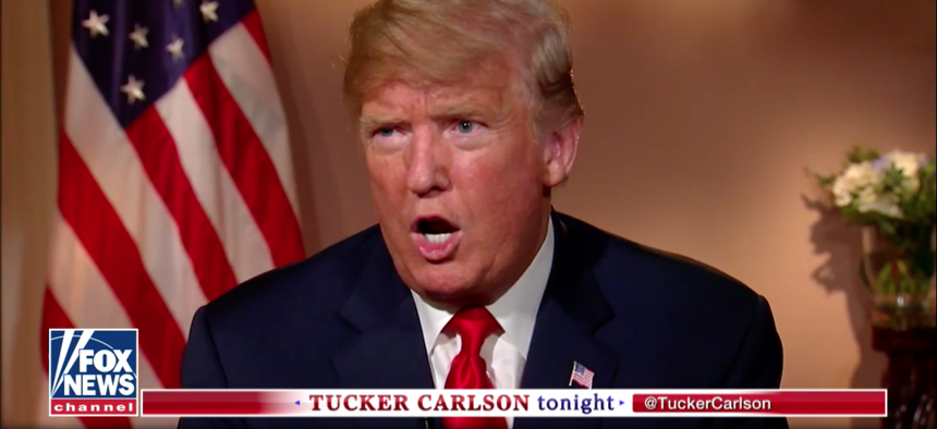 President Donald Trump talks with Fox News host Tucker Carlson on July 17, 2018.