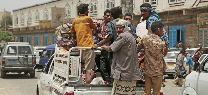Displaced Yemenis, who fled their homes by the fighting the port city of Hodeida, arrive in Sanaa, Yemen, Saturday, Jun. 23, 2018.