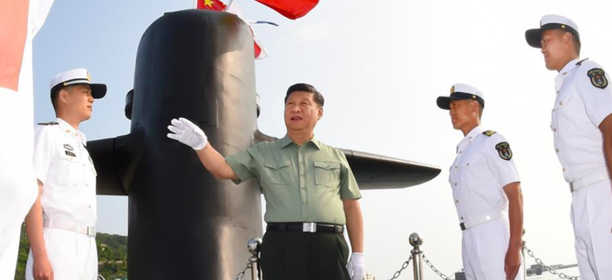 Chinese President Xi Jinping visits a submarine during an inspection to the navy under the Northern Theater Command of the Chinese People's Liberation Army, June 11, 2018.