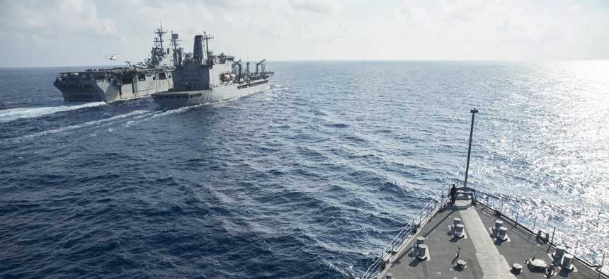 The Whidbey Island-class amphibious dock landing ship USS Germantown (LSD 42) approaches the Military Sealift Command fleet replenishment oiler UNSN Walter S. Diehl (T-AO 193) in the South China Sea in 2016.
