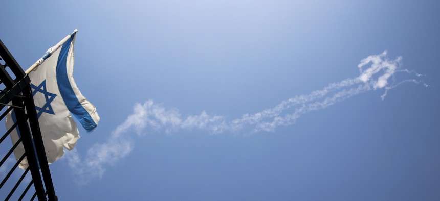 Trails of Patriot missiles are seen in the sky in northern Israel Tuesday, July 24, 2018. Israel shot down a Syrian fighter jet it said had breached its airspace on Tuesday while advancing Syrian government forces reached the Golan Heights frontier.