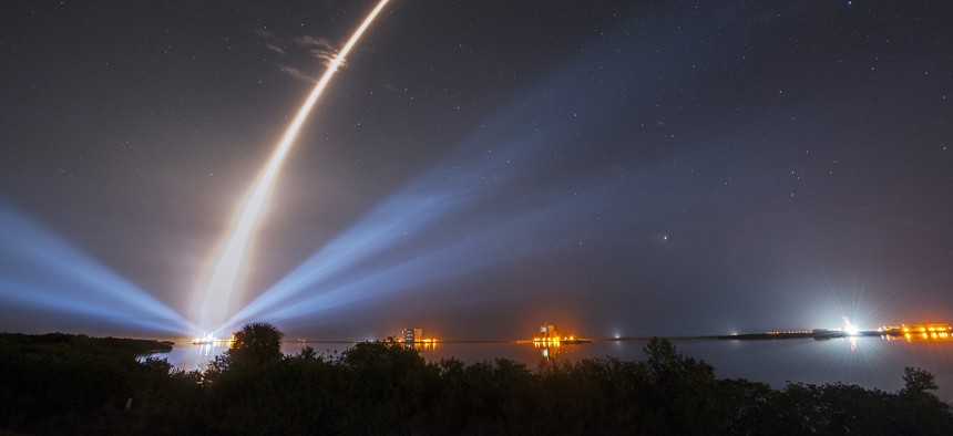 A United Launch Alliance (ULA) Atlas V rocket carrying the third Mobile User Objective System satellite for the U.S. Navy creates a light trail as it lifts off on Jan. 20, 2015.