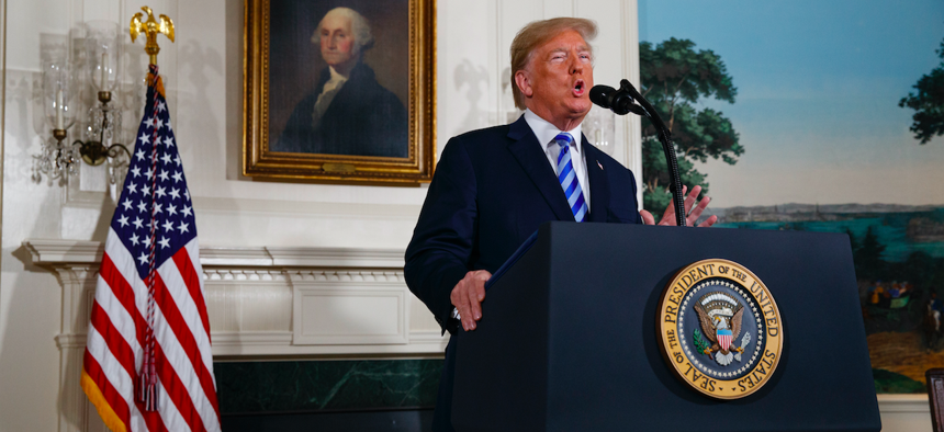President Donald Trump delivers a statement on the Iran nuclear deal from the Diplomatic Reception Room of the White House, Tuesday, May 8, 2018, in Washington.