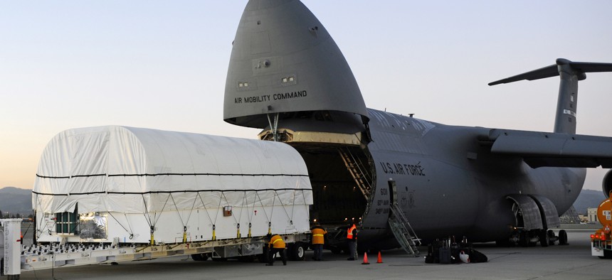 At Moffett Field in Sunnyvale Calif., technicians load the SBIRS GEO-2 satellite aboard a U.S. Air Force C-5B in preparation for shipment to Cape Canaveral Air Force Station, Fla., on Jan. 11, 2013.