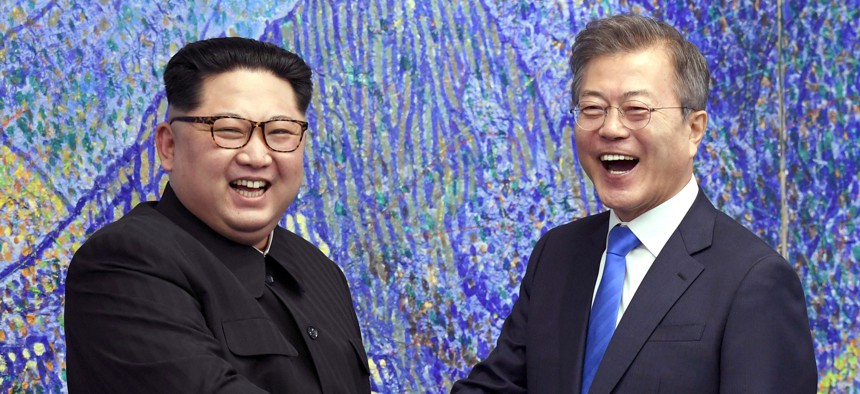 In this April 27, 2018 file photo, North Korean leader Kim Jong Un, left, poses with South Korean President Moon Jae-in for a photo inside the Peace House at the border village of Panmunjom in Demilitarized Zone, South Korea.