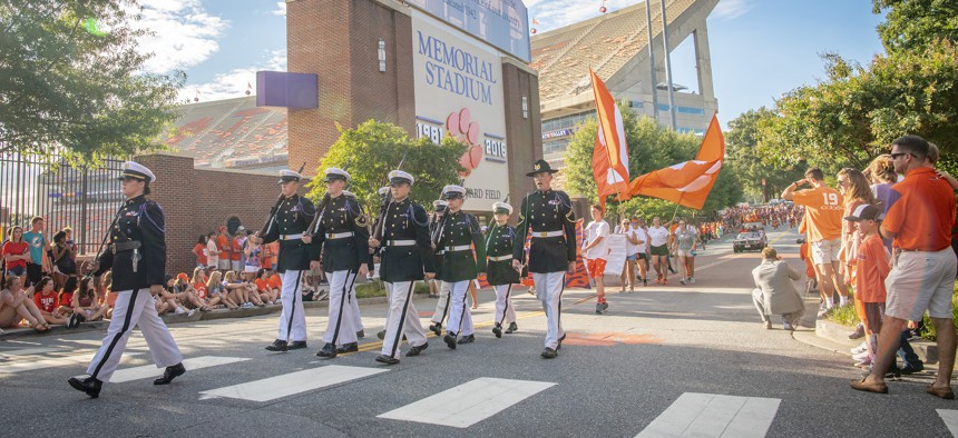Clemson University’s Army ROTC honor guard the Pershing Rifles lead the 2018 First Friday parade past Memorial Stadium on August 31, 2018.