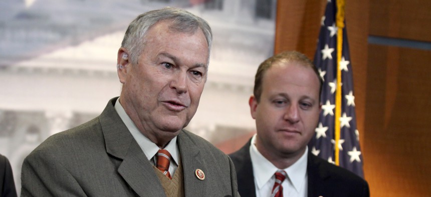 Rep. Dana Rohrabacher, R-Calif., left, accompanied by Rep. Jared Polis, D-Colo., speaks during a news conference on Capitol Hill in Washington, Thursday, Nov, 13, 2014, to discuss marijuana laws.