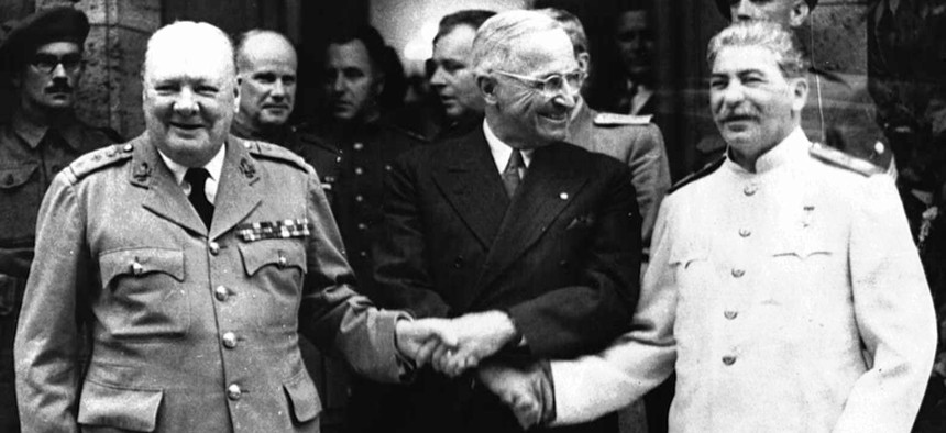 A photo from July 23, 1945 showing the handshake between Winston Churchill, left, Harry S. Truman and Josef Stalin, right infront of Churchill's residence in Potsdam, Germany.