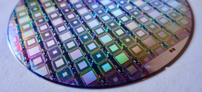 A wafer full of D-Wave's latest quantum processors as shown at the Age of AI conference in February 2018.