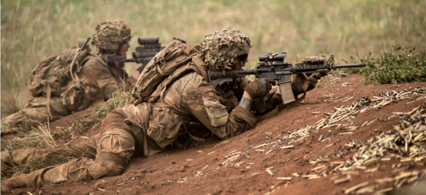 U.S. Army Soldiers assigned to 1st Battalion, 21st Infantry Regiment "Gimlets", 2nd Infantry Brigade Combat Team, 25th Infantry Division, provide protective fire support during a combined arms live-fire exercise at Schofield Barracks, August 9, 2018.