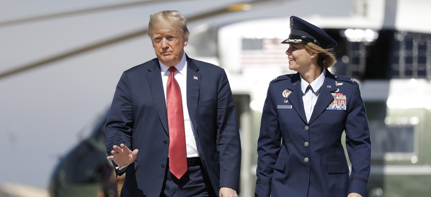 President Donald Trump arrives to board Air Force One for a trip to Minnesota to attend a fundraiser, and a campaign rally, Oct. 4, 2018, in Andrews Air Force Base, Md.