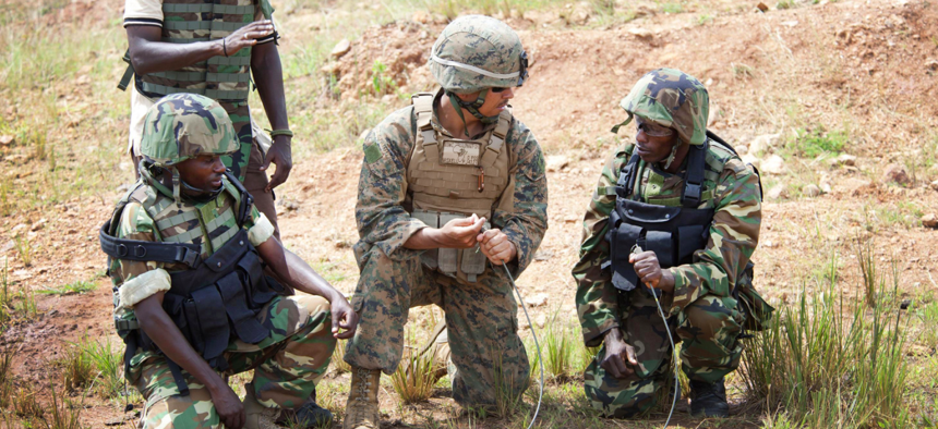 A U.S. Marine from the Special-Purpose Marine Air-Ground Task Force Africa demonstrates combat engineer skills for Burundi National Defense Forces personnel.