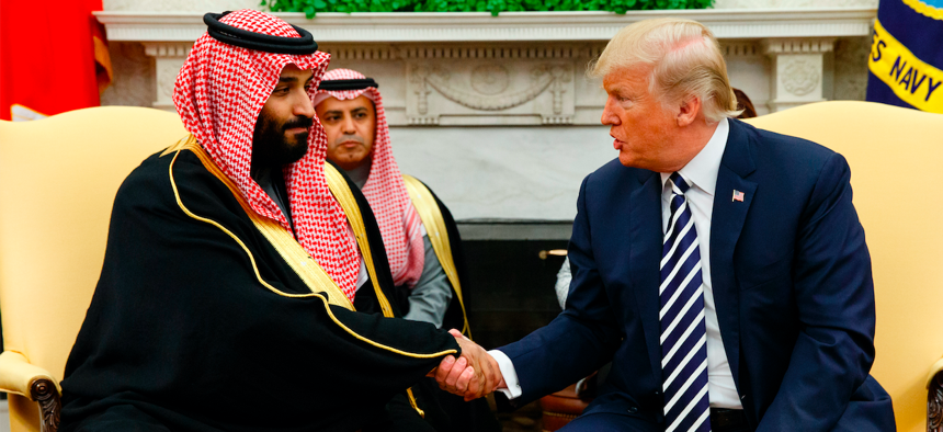 In this March 20, 2018, file photo, President Donald Trump shakes hands with Saudi Crown Prince Mohammed bin Salman in the Oval Office of the White House in Washington.