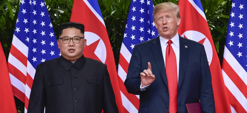 In this June 12, 2018, file photo, U.S. President Donald Trump makes a statement before saying goodbye to North Korea leader Kim Jong Un after their meetings at the Capella resort on Sentosa Island in Singapore.