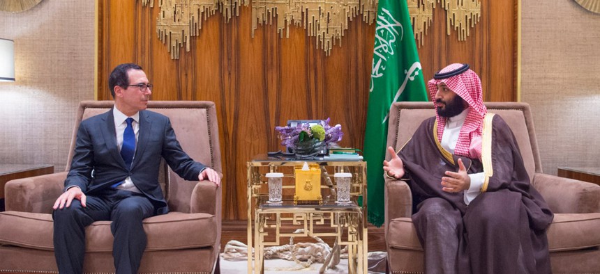 In this Monday, Oct. 22, 2018 photo released by Saudi Press Agency, SPA, Saudi Crown Prince, Mohammed bin Salman, right, talks with the U.S. Secretary of the Treasury Steven Mnuchin in Riyadh, Saudi Arabia.