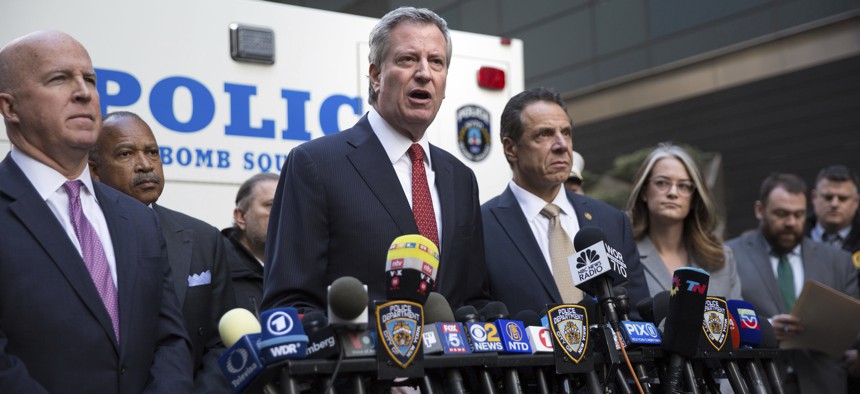 Mayor Bill de Blasio delivers remarks during a press conference after NYPD personnel removed an explosive device from Time Warner Center Wednesday, Oct. 24, 2018, in New York.