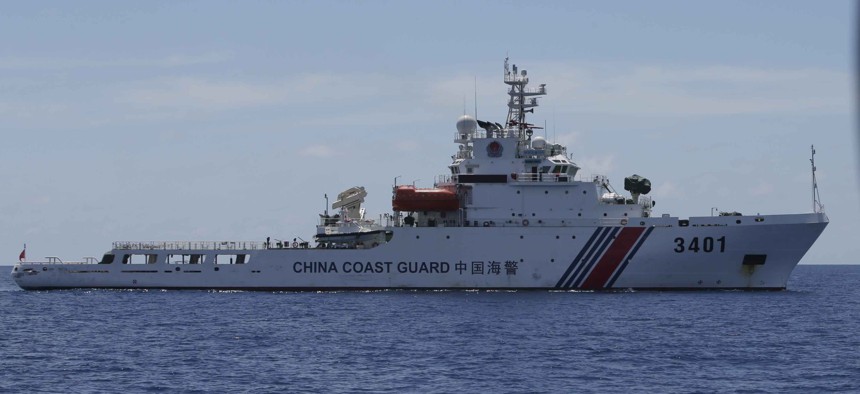 A China Coast Guard vessel attempts to block a Philippine government vessel as the latter tries to enter the China Second Thomas Disputed Shoals, locally known as name Ayungin Shoal, to orate Philippine troops and resupply provisions March 29, 2014.