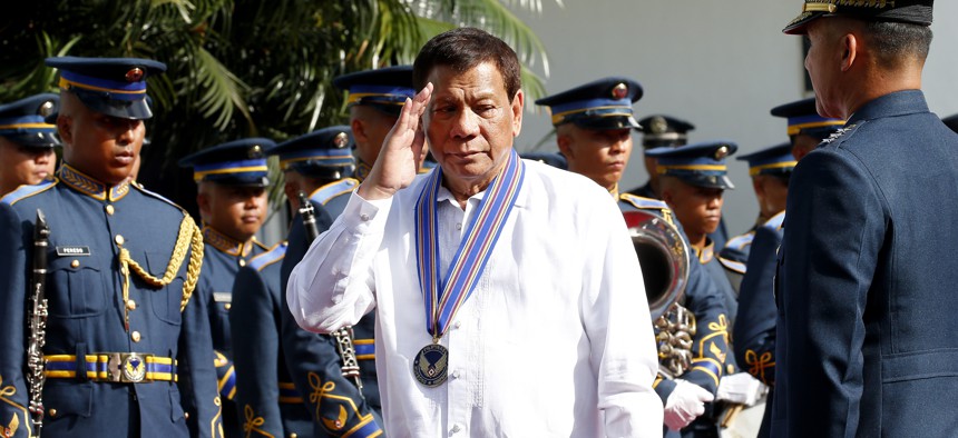 Philippine President Rodrigo Duterte salutes during a wreath-laying ceremony at the 71st Founding Anniversary of the Philippine Air Force at Villamor Air Base in suburban Pasay city south of Manila, Philippines Tuesday, July 3, 2018.