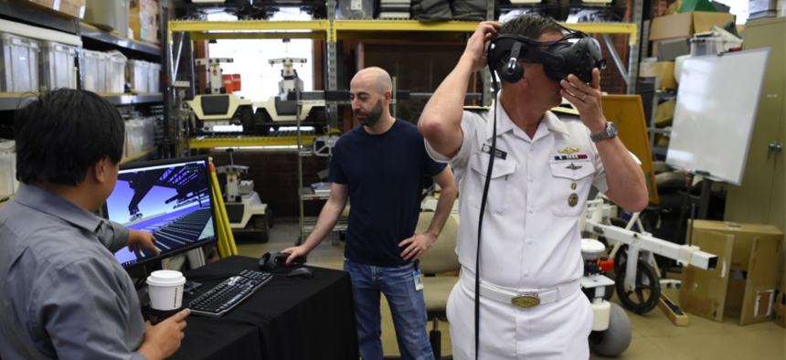 Rear Adm. David Hahn, chief of naval research, tours the National Robotics Engineering Center while attending the AI & Autonomy for Humanitarian Assistance and Disaster Relief workshop, co-hosted by the Office of Naval Research and Carnegie Mellon Univ.