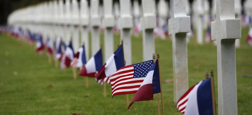 American and French flags are arranged in the Meuse-Argonne cemetery in France for a remembrance ceremony on Sept. 23, 2018. 