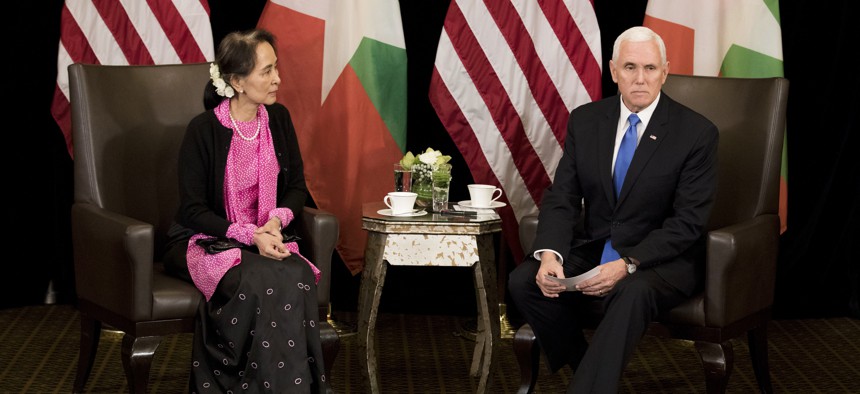 U.S. Vice President Mike Pence, right, meets Myanmar leader Aung San Suu Kyi in Singapore, Wednesday, Nov. 14, 2018.